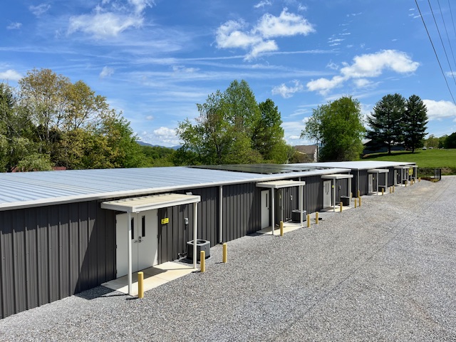Row of Incredible Storage drive-up units on a gravel drive at 472 McDonald Rd in Hayesville, North Carolina
